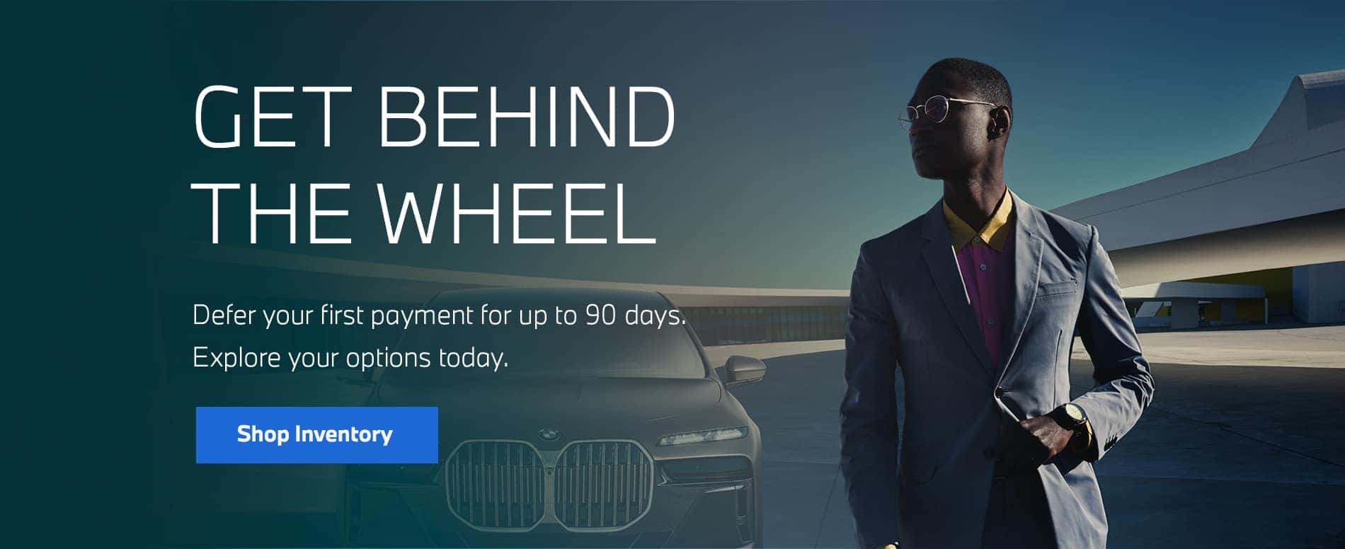 Man in front of BMW vehicle.