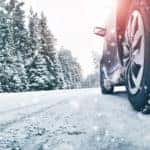 Calgary Hyundai | Closeup of car tires in winter on the road