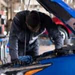 Chevy Technician Examining Engine
