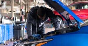 Chevy Technician Examining Engine