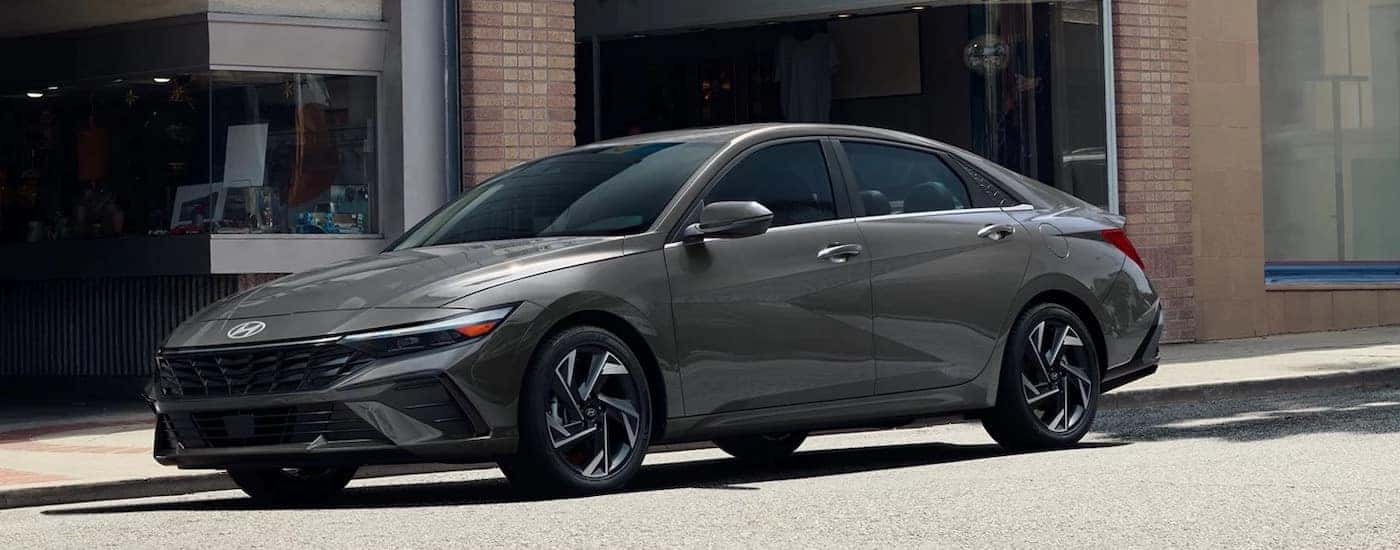 A grey 2025 Hyundai Elantra is shown from the side.