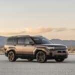 Brown Hyundai Santa Fe Hybrid vehicle with a mountain view