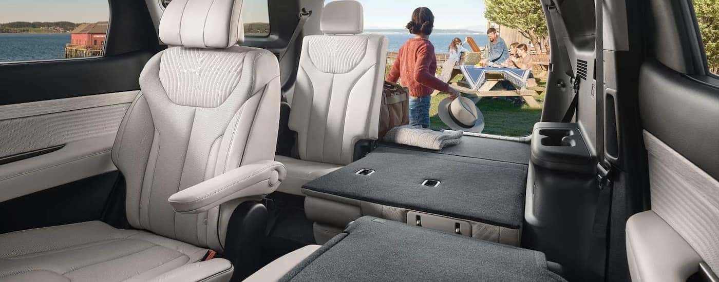 A view of the second and third row power folding seats in a 2025 Hyundai Palisade.