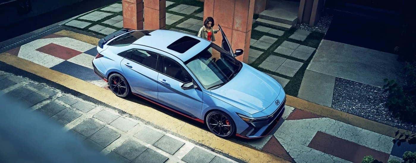 A blue 2025 Hyundai Elantra N from a high angle after leaving a Hyundai dealer near Selma.