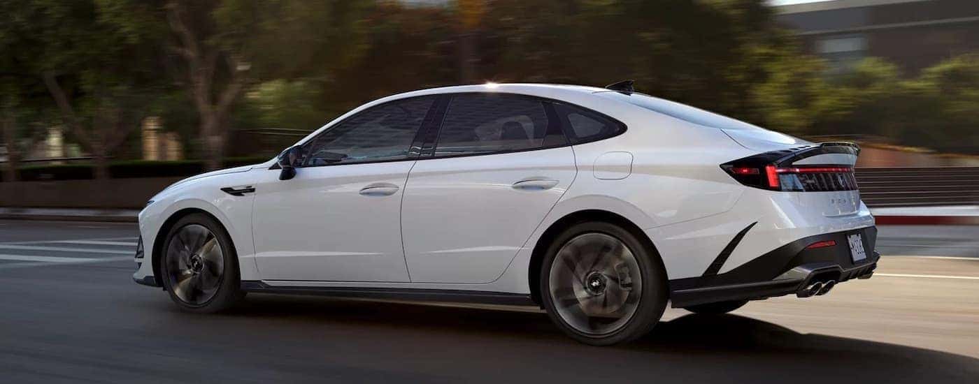 A white 2025 Hyundai Sonata from the side after leaving a Hyundai dealer near Birmingham.