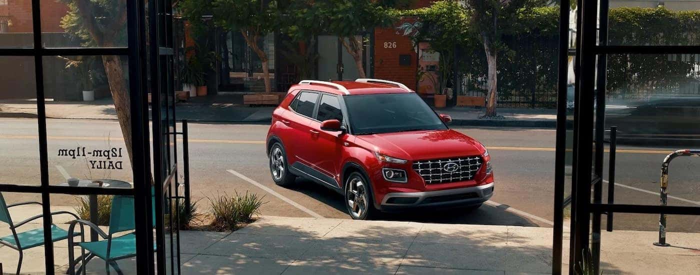 A red 2023 Hyundai Venue from the front at an angle.