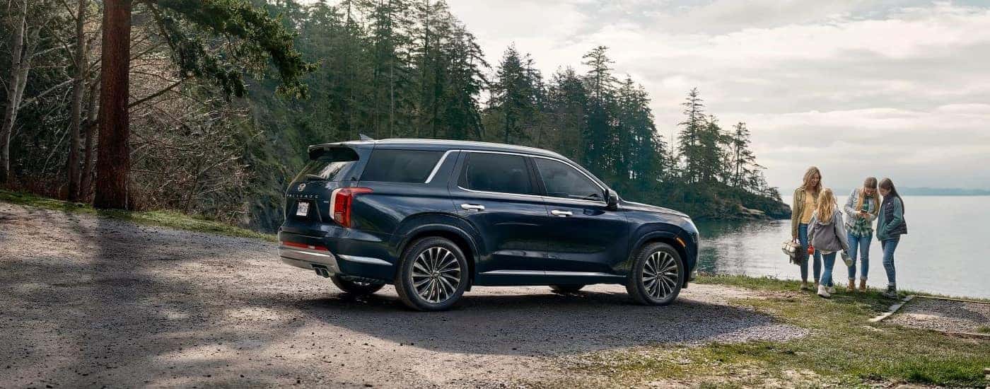 A blue 2023 Hyundai Palisade from a used car dealer near Enterprise