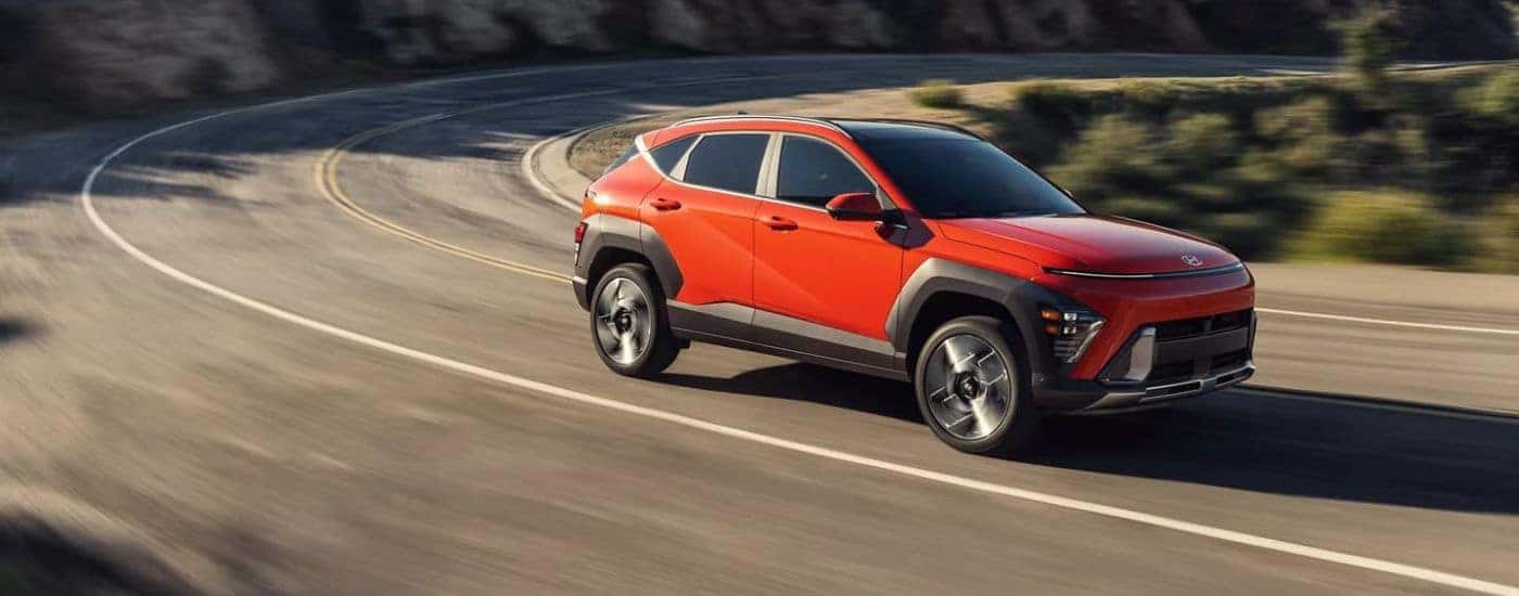 A red used 2024 Hyundai Kona Limited at car dealer near Birmingham