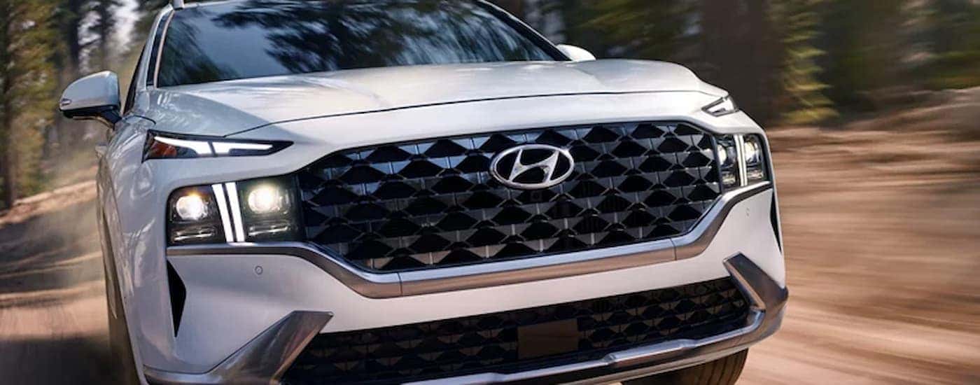 A white used 2023 Hyundai Santa Fe at a car dealer near Trussville