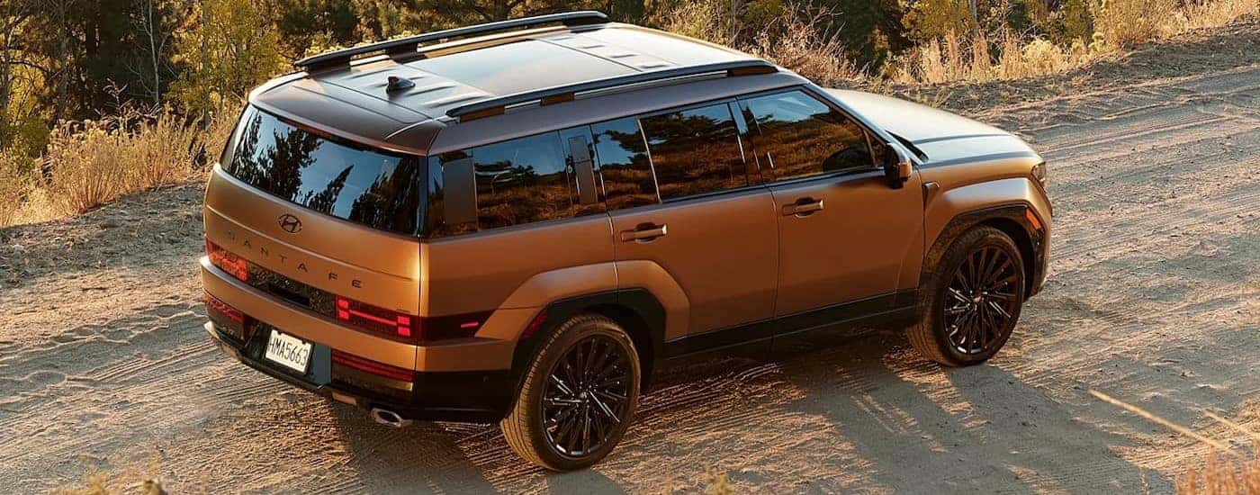 A copper 2026 Hyundai Santa Fe for sale near Auburn parked off-road.