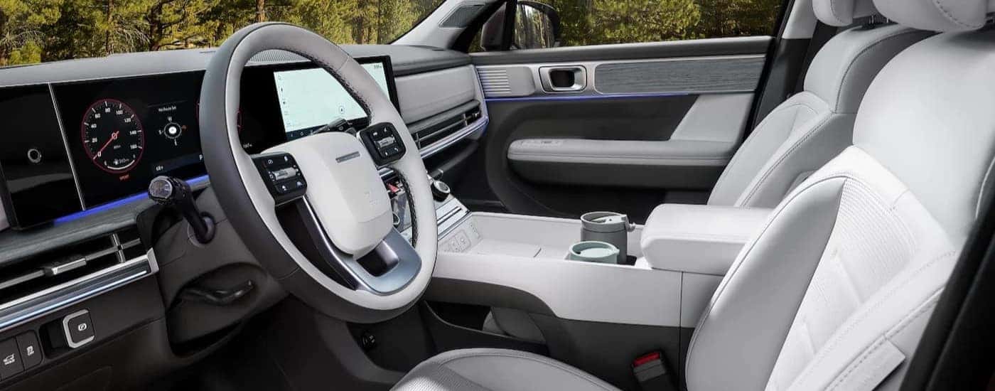 The white and gray interior and dash in a 2026 Hyundai Santa Fe for  sale in Montgomery.