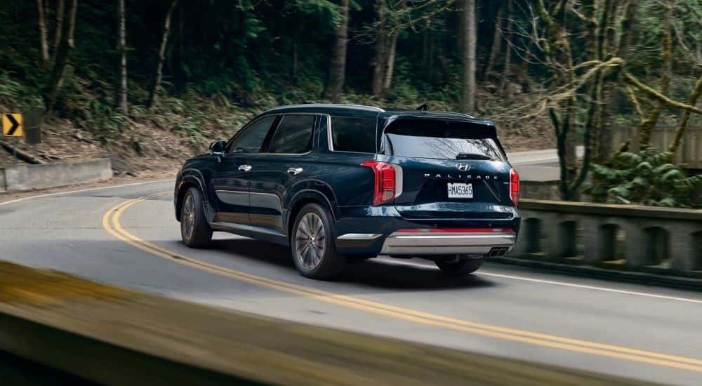 A used green 2023 Hyundai Palisade for sale on a test drive