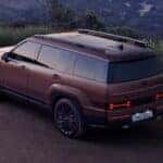A copper 2024 Hyundai Santa Fe parked on a dirt lot.