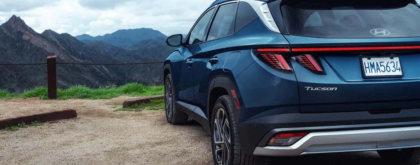 Taillights on a blue 2025 Hyundai Tucson parked off-road