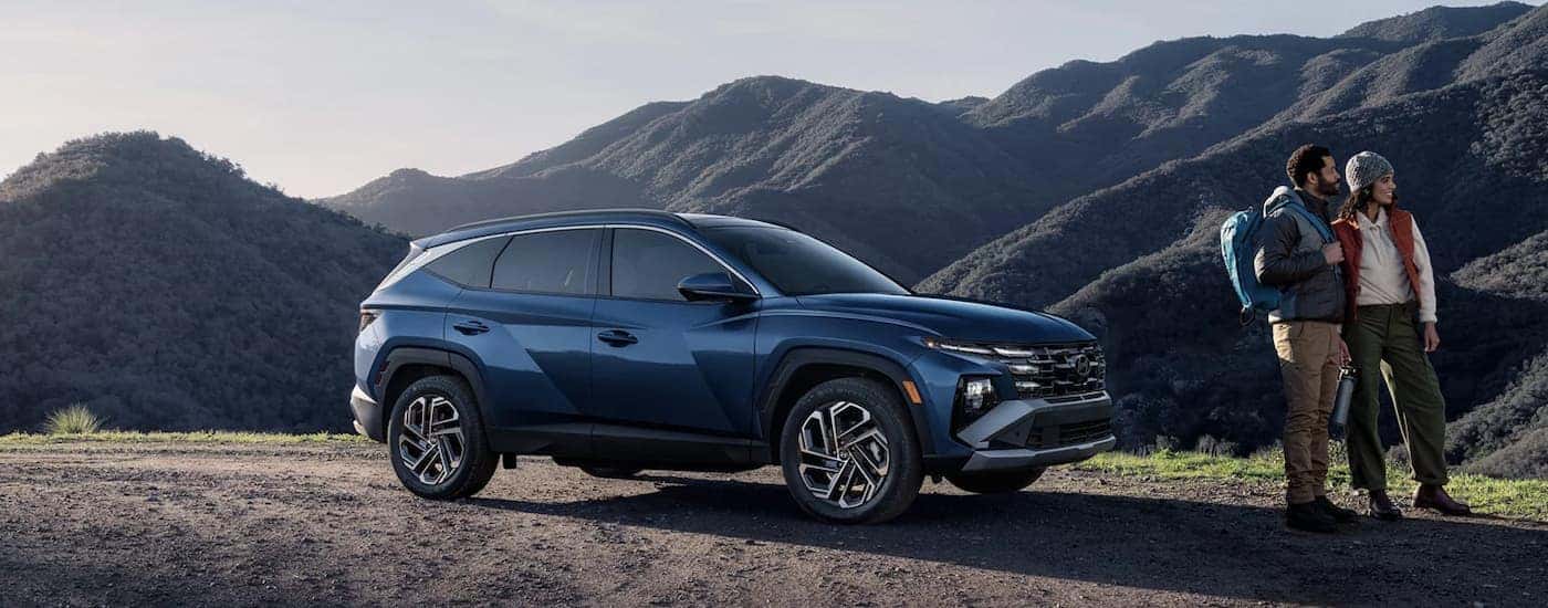 A blue 2026 Hyundai Tucson parked for sale near Enterprise