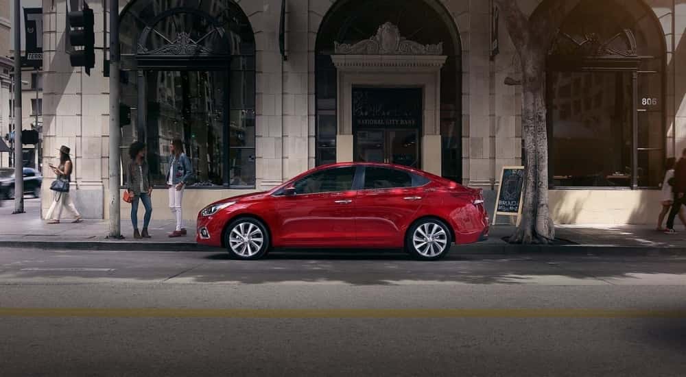 A red 2020 Hyundai Accent shown parked in a city.
