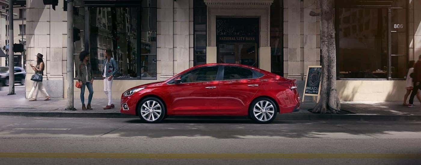 A red 2020 Hyundai Accent shown parked in a city.