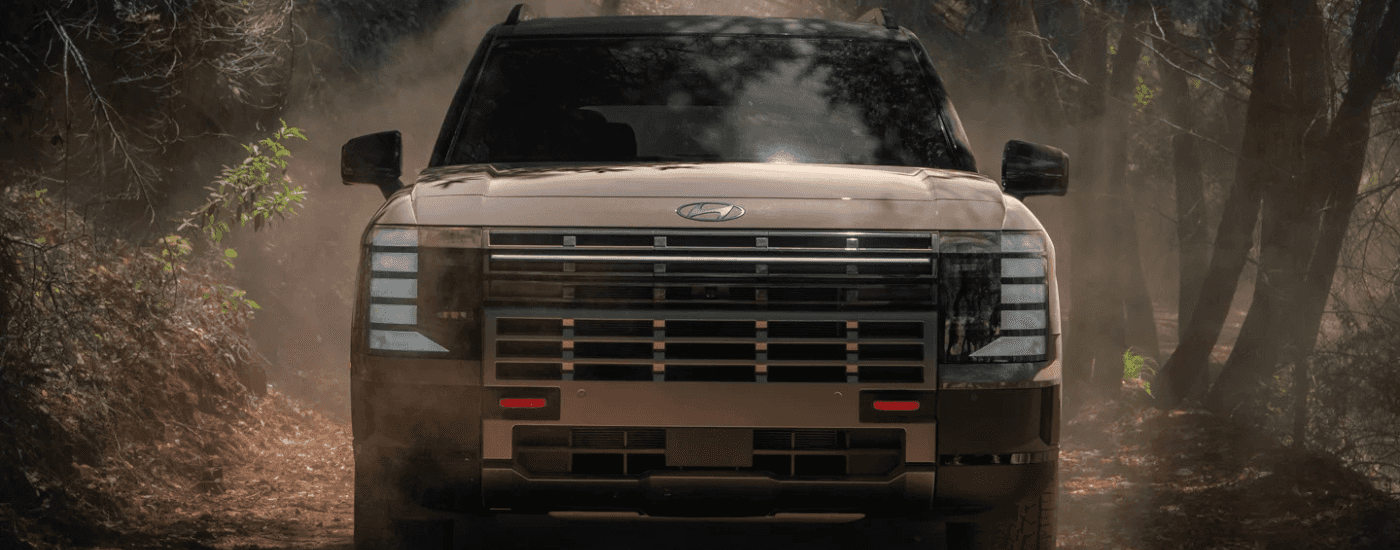 Brown 2026 Hyundai Palisade XRT driving off-road