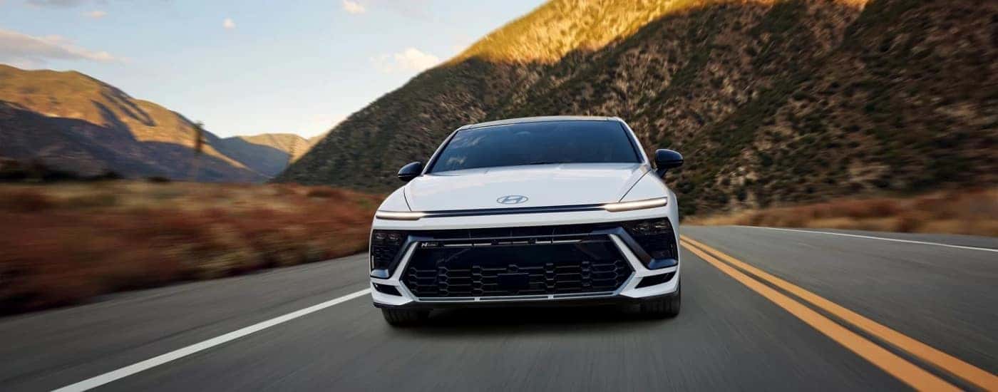 A white 2025 Hyundai Sonata N-Line shown driving head-on.