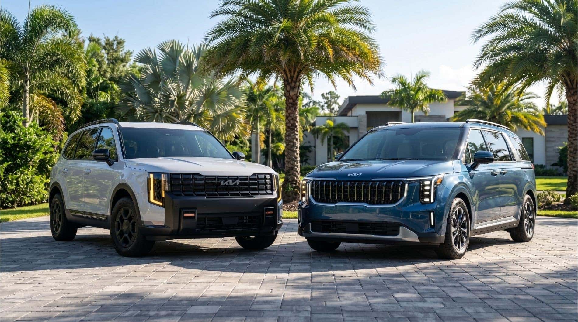 2026 Kia Telluride and 2026 Kia Carnival parked in a modern Florida driveway