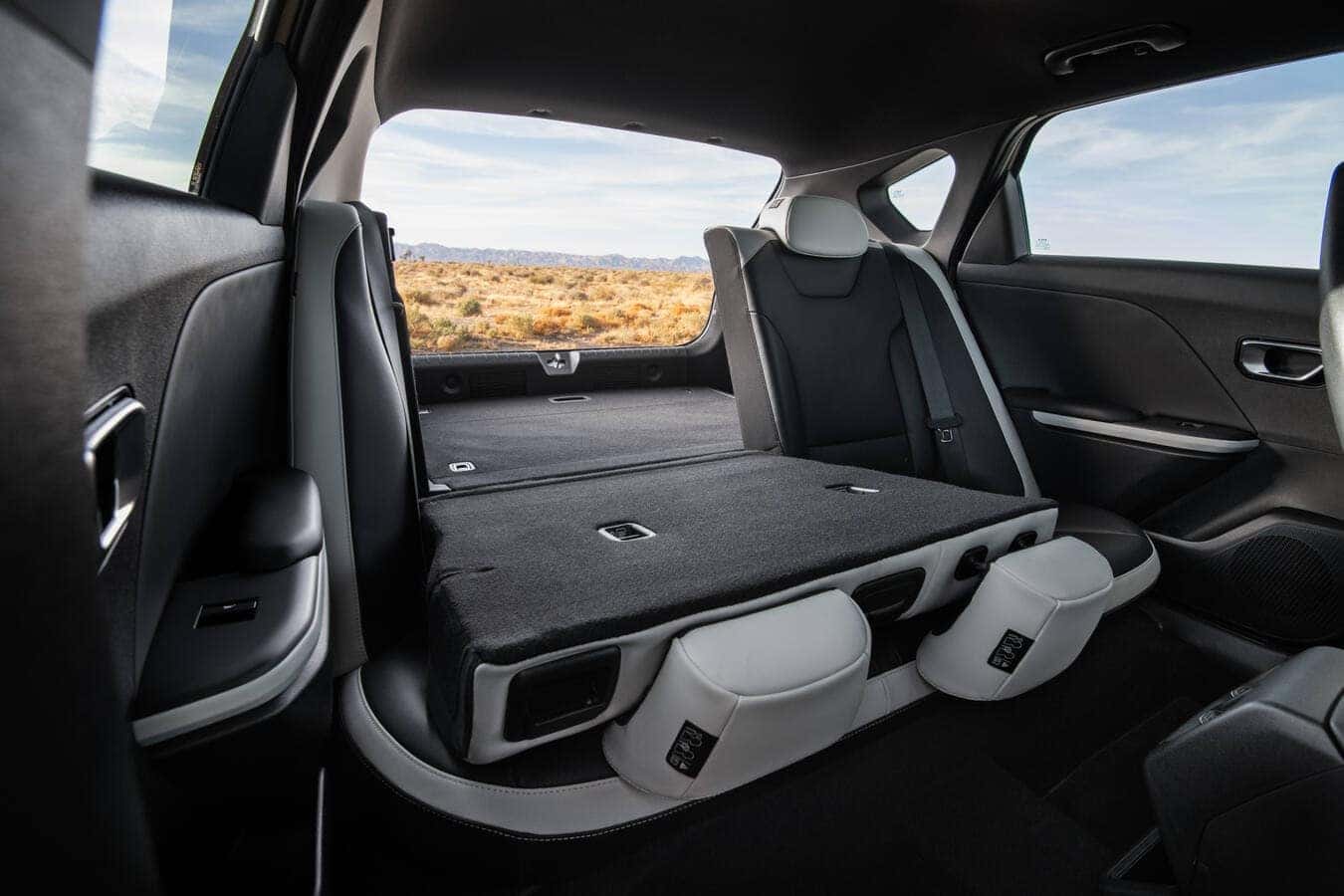 The 2026 Kia K4 Hatchback showing rear seats folded completely flat to reveal 59.3 cubic feet of cargo room