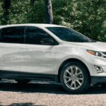 2020 chevy equinox white exterior parked outside forest home