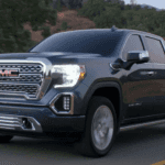 2021 gmc sierra black exterior driving down road