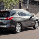 2021 chevy equinox silver exterior driving down road