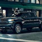 2020 chevy silverado 1500 black parked at night in city scene
