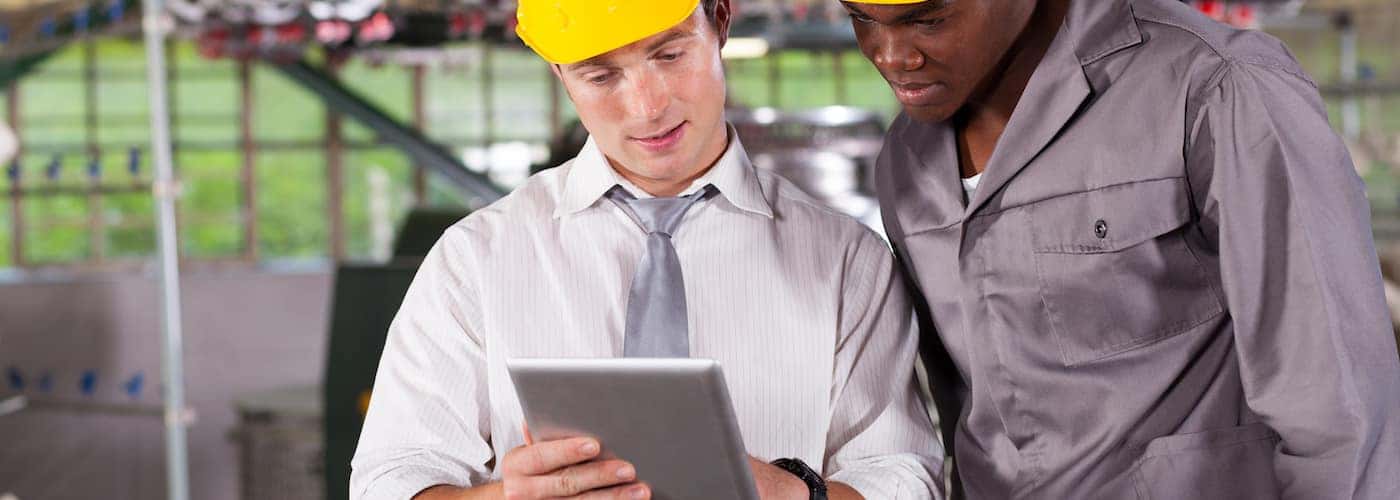 factory employees reviewing plans