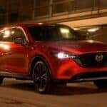 Soul red Mazda cx-5 driving at night