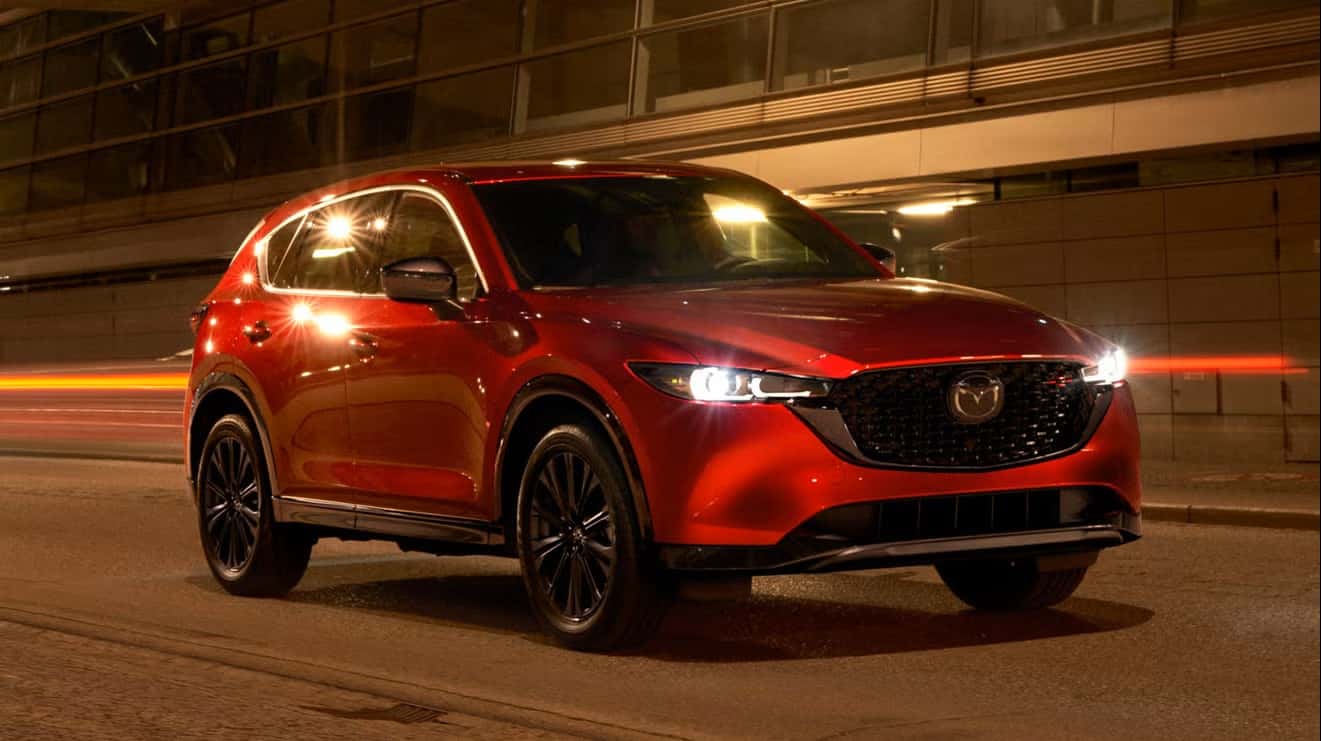 Soul red Mazda cx-5 driving at night
