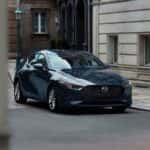 Mazda3 Hatchback parked outside of a building.