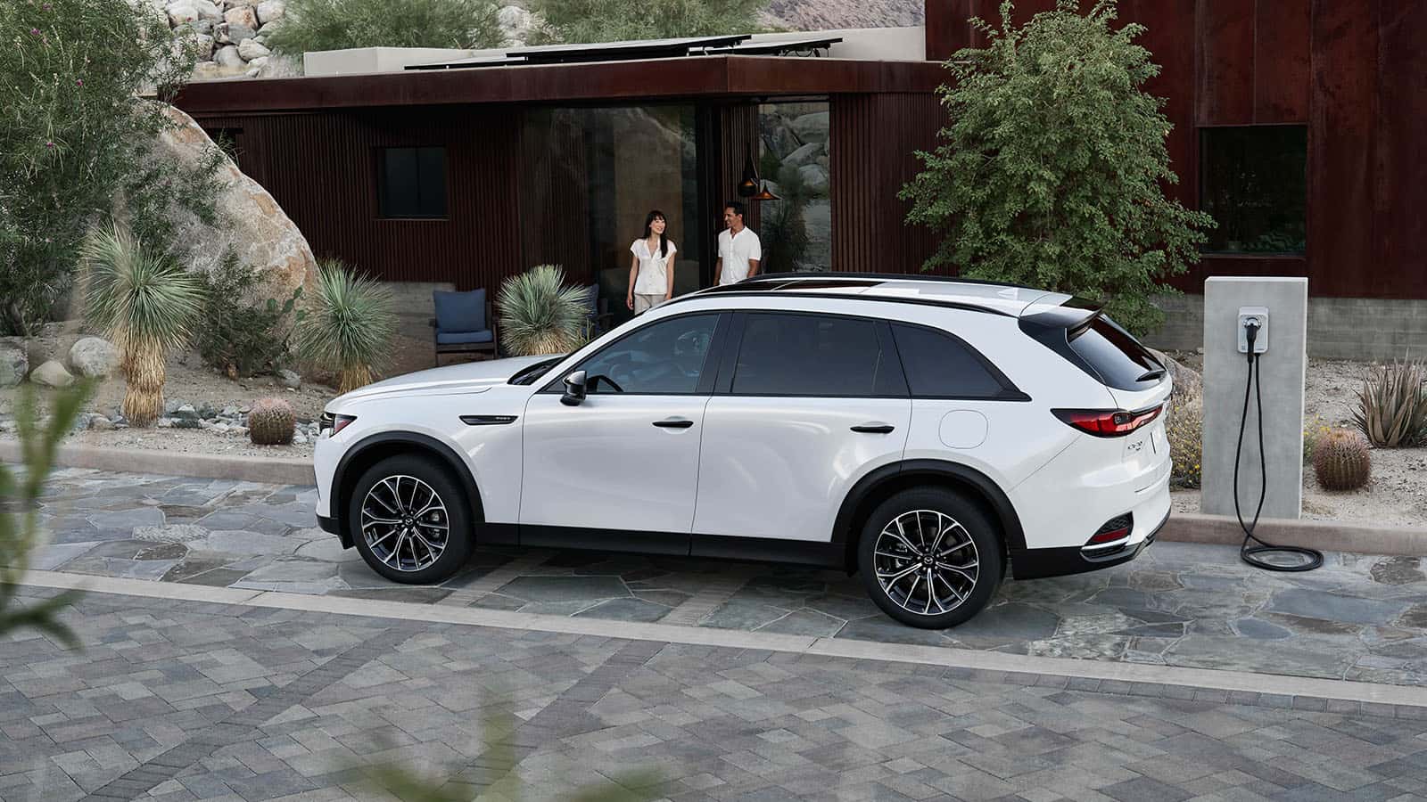 A white Mazda CX-70 parked outside.