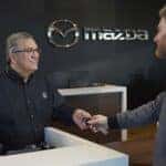 Mazda service advisor with a customer