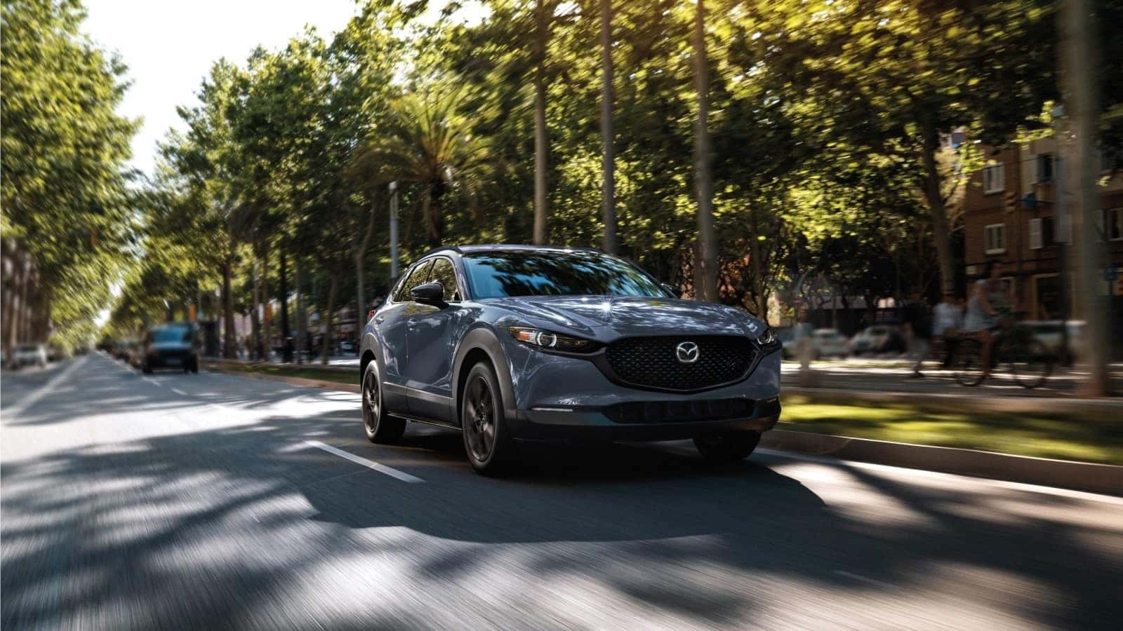 Mazda CX-30 driving on a scenic road