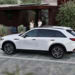 Mazda SUV charging driveway