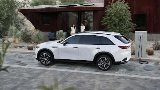 Mazda SUV charging driveway