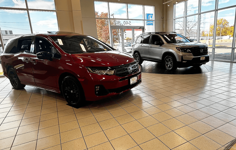 2025 Honda Odyssey in Red and Honda Passport Silver