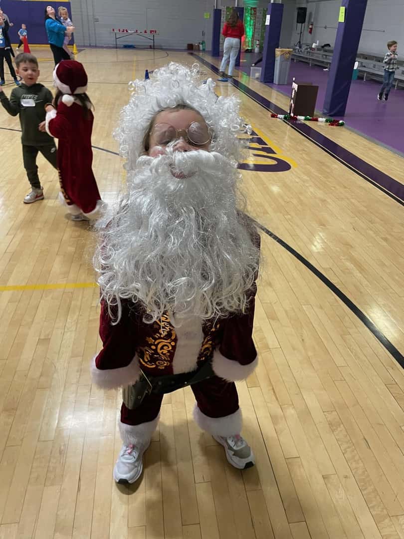 small child dressed as santa