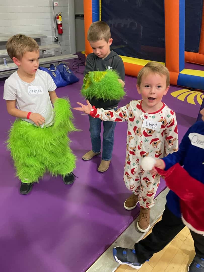 children with green fur grinch costume