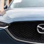 Front grille of a Mazda with Mazda logo