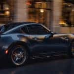 Mazda Miata RF cruising downtown at dusk