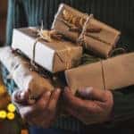 Unrecognizable male hands holding organic Christmas presents.