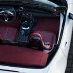 overhead shot of a white miata with red interior
