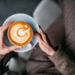 Woman Holding Coffee Latte