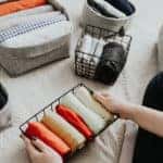 Woman folding and organizing wardrobe