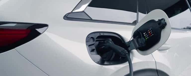 Mazda EV at a charging station