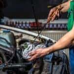 Oconomowoc, wi mechanic checking the oil in a vehicle