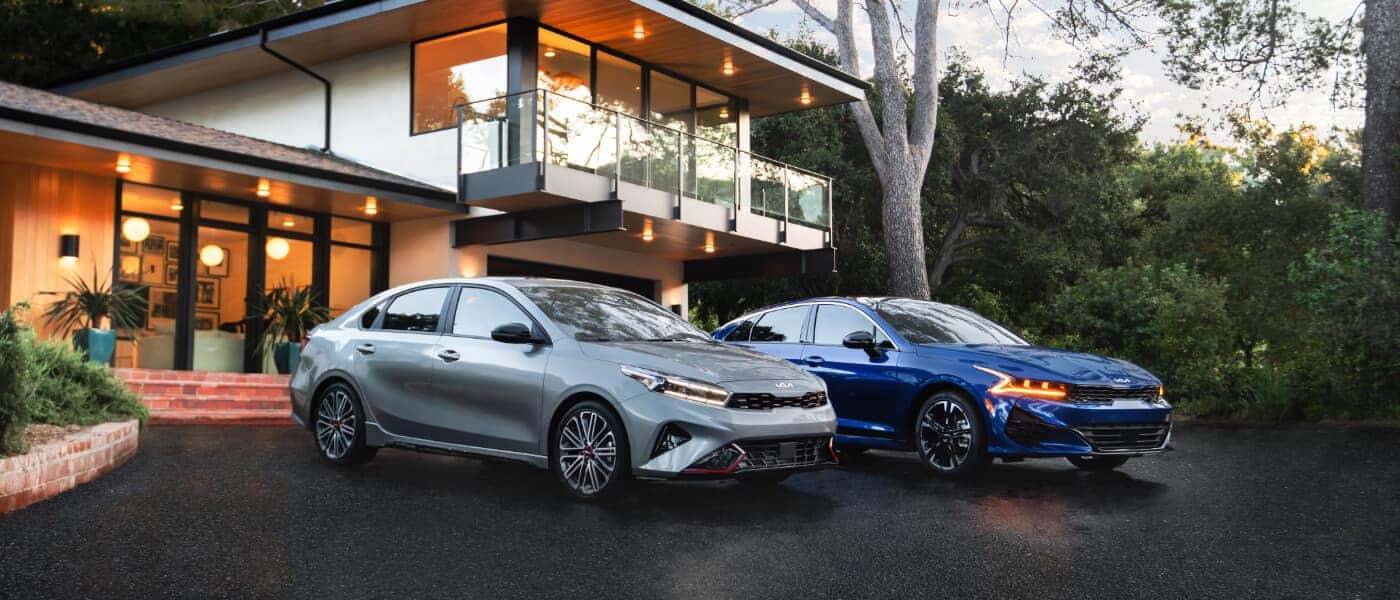 2026 Kia K5 pair parked outside house